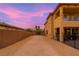Side view of a yard featuring a pool, lush landscaping, block fencing, and ample privacy at 6351 Abacus Farms Ct, Las Vegas, NV 89131