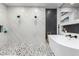 Luxurious bathroom featuring a freestanding tub, dual showers, and stylish tile work, offering a spa-like experience at 6351 Abacus Farms Ct, Las Vegas, NV 89131