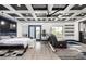 Spacious bedroom featuring a unique coffered ceiling, plush bedding, and a sitting area with exterior access at 6351 Abacus Farms Ct, Las Vegas, NV 89131