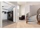 Open floor plan with a foyer, staircase, sitting area, high ceilings, and stylish design at 6351 Abacus Farms Ct, Las Vegas, NV 89131
