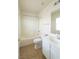 Bathroom featuring a shower-tub combo, a vanity with sink, and neutral tile flooring at 6493 Yellow Bells Ct, Las Vegas, NV 89131