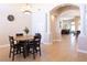 Elegant dining area featuring an archway leading to living spaces and a chandelier that enhances the room's ambiance at 6493 Yellow Bells Ct, Las Vegas, NV 89131