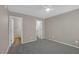Bedroom with neutral walls, carpeted floors, a ceiling fan and two doors at 701 Capri Dr # 6A, Boulder City, NV 89005