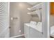 Laundry area with a washing machine, dryer, and white shelving at 701 Capri Dr # 6A, Boulder City, NV 89005