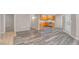 Spacious living area showcases wood-look floors and connects to the kitchen at 701 Capri Dr # 6A, Boulder City, NV 89005