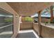 This patio has concrete flooring, a stone wall, and is partially covered to create an inviting space at 701 Capri Dr # 6A, Boulder City, NV 89005