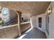 This patio has concrete flooring, a stone wall, and is partially covered to create an inviting space at 701 Capri Dr # 6A, Boulder City, NV 89005