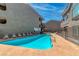 Relaxing community pool and sundeck area with comfortable lounge chairs and secure fencing at 701 Capri Dr # 6A, Boulder City, NV 89005