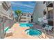 Inviting community pool and hot tub surrounded by lounge chairs for residents' relaxation at 701 Capri Dr # 6A, Boulder City, NV 89005