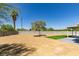 The backyard boasts gravel landscaping, block wall and a small patch of artificial turf at 7133 Tropical Island Cir, Las Vegas, NV 89129