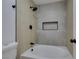 Close-up of the modern tiled shower and soaking tub in bathroom at 7133 Tropical Island Cir, Las Vegas, NV 89129