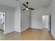 Modern bedroom with a ceiling fan, neutral paint, light floors, and white trim at 7133 Tropical Island Cir, Las Vegas, NV 89129