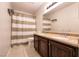 Full bathroom with double sinks, ample vanity storage, and a shower-tub combination at 815 Adagio St, Henderson, NV 89052