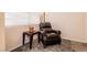 Well lit space with armchair, carpet flooring, and accent table at 815 Adagio St, Henderson, NV 89052