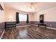 Large carpeted bedroom with neutral walls, modern ceiling fan, and ample space for various activities at 815 Adagio St, Henderson, NV 89052