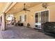 Relaxing covered patio with ceiling fans and comfortable seating overlooking the pool at 815 Adagio St, Henderson, NV 89052