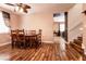 Cozy dining area featuring wood floors, a wooden table with six chairs, and stairway at 815 Adagio St, Henderson, NV 89052