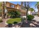 Charming front yard with manicured turf, palm trees, and a well-maintained exterior at 815 Adagio St, Henderson, NV 89052