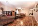 Open-concept living room with wood floors, cozy furniture, and adjacent dining area at 815 Adagio St, Henderson, NV 89052