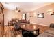 Spacious living room featuring hardwood floors, comfortable sofas, and an open floor plan at 815 Adagio St, Henderson, NV 89052