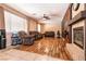 Spacious living room with cozy seating, fireplace, ceiling fan, and ample natural light at 815 Adagio St, Henderson, NV 89052