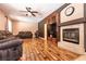 Inviting living room with fireplace, ceiling fan, and comfortable seating arrangement at 815 Adagio St, Henderson, NV 89052