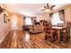 Comfortable living room features hardwood floors and a dining area set for four at 815 Adagio St, Henderson, NV 89052