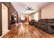 Spacious living room leading into kitchen with tile floors and comfortable couches at 815 Adagio St, Henderson, NV 89052