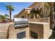 Built-in outdoor kitchen featuring a stainless steel grill and prep area at 815 Adagio St, Henderson, NV 89052
