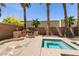 Outdoor spa next to a built in seating and BBQ in a landscaped backyard at 815 Adagio St, Henderson, NV 89052