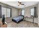Comfortable bedroom featuring wood floors, neutral walls, and bright natural light at 8531 W Oquendo Rd, Las Vegas, NV 89113