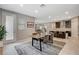 Charming dining area featuring a wooden table, comfortable seating, and access to the kitchen and living room areas at 8531 W Oquendo Rd, Las Vegas, NV 89113