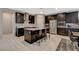 Well-appointed kitchen with stainless steel appliances, granite countertops, and a breakfast bar with seating for casual dining at 8531 W Oquendo Rd, Las Vegas, NV 89113