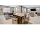 Open-concept kitchen with stainless steel sink and breakfast bar with a view of the living room at 8531 W Oquendo Rd, Las Vegas, NV 89113