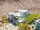 Contemporary home with desert landscaping featuring a pool, a patio, and an umbrella at 865 Auroras Edge Ct, Henderson, NV 89012