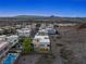 Aerial view of a modern home in a desert community with city views and community neighborhood at 865 Auroras Edge Ct, Henderson, NV 89012