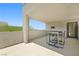 Inviting patio with desert landscape views and outdoor seating with an outside door to access the house at 865 Auroras Edge Ct, Henderson, NV 89012