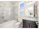 Bright bathroom with a soaking tub and tiled shower at 865 Auroras Edge Ct, Henderson, NV 89012