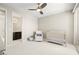 Cozy bedroom with a crib, glider, and attached bathroom at 865 Auroras Edge Ct, Henderson, NV 89012