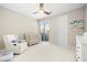 Light-filled Bedroom with a crib, glider, and access to a private balcony at 865 Auroras Edge Ct, Henderson, NV 89012