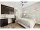 Cozy bedroom with a ceiling fan, built-in desk, and a view of the mountains at 865 Auroras Edge Ct, Henderson, NV 89012