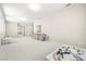 Large bonus room with neutral walls and carpet, perfect for a playroom or home office space at 865 Auroras Edge Ct, Henderson, NV 89012