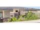 Modern home with desert landscaping and a view of the city skyline at 865 Auroras Edge Ct, Henderson, NV 89012