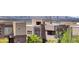 Upscale neighborhood featuring modern home designs and city views in the distance at 865 Auroras Edge Ct, Henderson, NV 89012