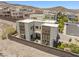 Contemporary home showcasing modern design, landscaping, and a private outdoor space at 865 Auroras Edge Ct, Henderson, NV 89012