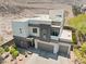 Beautiful modern home with a three-car garage, desert landscaping, and manicured shrubbery at 865 Auroras Edge Ct, Henderson, NV 89012