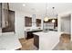 Stylish kitchen boasting stainless appliances, dark wood cabinets, and pendant lighting at 865 Auroras Edge Ct, Henderson, NV 89012