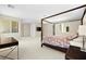 The spacious main bedroom features a four-poster bed and ample natural light at 865 Auroras Edge Ct, Henderson, NV 89012