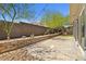 Private backyard patio with a low retaining wall and gravel accents at 865 Auroras Edge Ct, Henderson, NV 89012