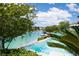 Scenic waterfront view from the backyard, featuring a pool and boat dock at 8725 Newport Isle Ct, Las Vegas, NV 89117
